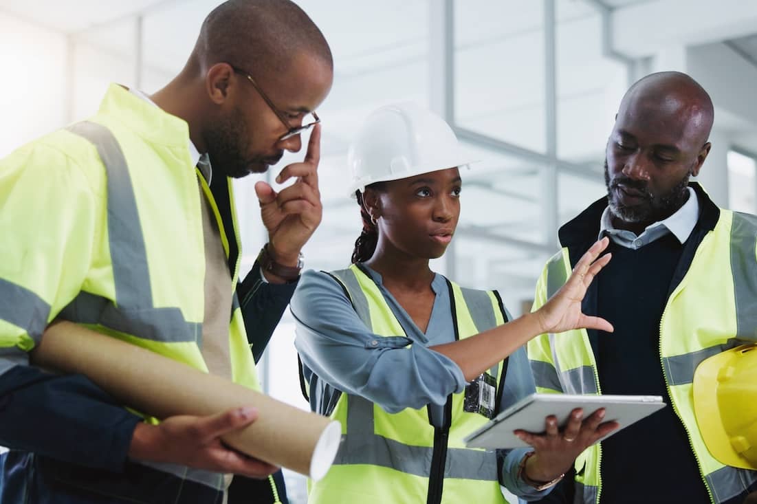 Construction estimators reviewing project drawings