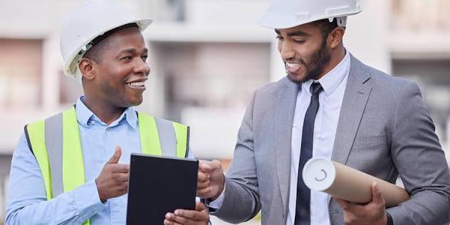 Construction bid management services: estimators reviewing bid documents and project proposals