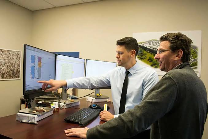 Dedicated construction estimator preparing a project cost estimate and material takeoff